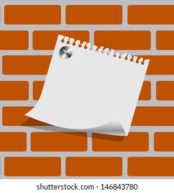 sheet of paper on a brick wall with a place for your text