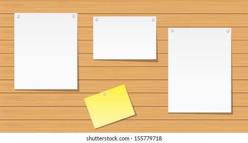 Sheets of paper on a wooden wall