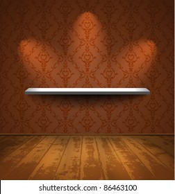 Shelf on a wall with wallpaper in room with wooden floor