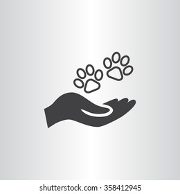Shelter pets sign icon. Hand holds paw symbol. Animal protection