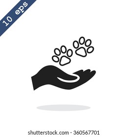 Shelter pets sign icon. Hand holds paw symbol. Animal protection