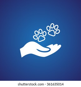 Shelter pets sign icon. Hand holds paw symbol. Animal protection