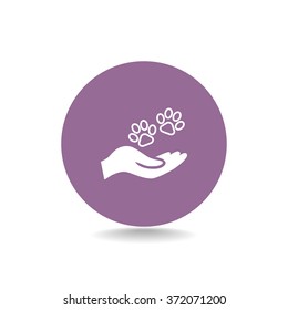 Shelter pets sign icon. Hand holds paw symbol. Animal protection