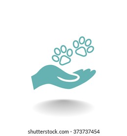 Shelter pets sign icon. Hand holds paw symbol. Animal protection