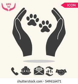 Shelter pets sign icon. Hands holds paw symbol. Animal protection