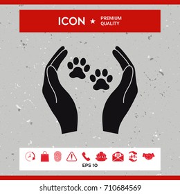 Shelter pets sign icon. Hands holds paw symbol. Animal protection
