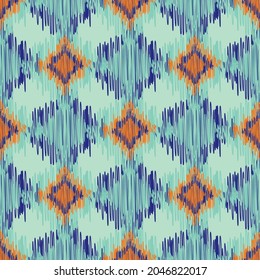 Shibori style ikat vector seamless vector pattern background. Scribbled diamond shapes backdrop in orange, green blue. Weave effect repeat. Simulated woven geometric all over print wellness, packaging