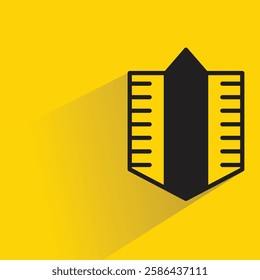 shield badge icon with shadow on yellow background