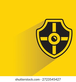 Símbolo de la insignia del escudo con la sombra sobre fondo amarillo