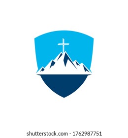 Shield Baptist cross in mountain logo design. Cross on top of the mountain.