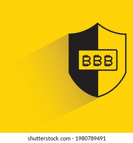 shield and bitcoin symbol with shadow on yellow background