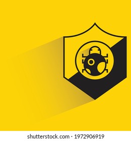 shield and bug for malware protection on yellow background