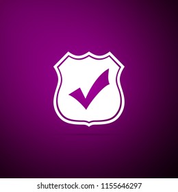 Shield with check mark icon isolated on purple background. Flat design. Vector Illustration