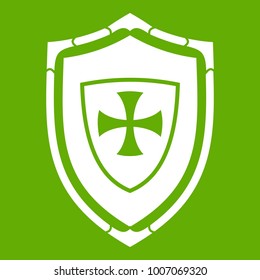 Shield with cross icon white isolated on green background. Vector illustration