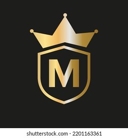 Shield Crown Logo On Letter M Vector Symbol With Elegant Gold Color
