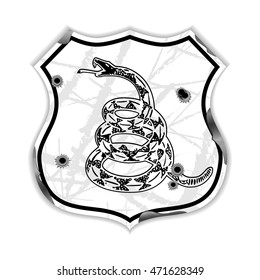 The shield in the form of a road sign depicting a rattlesnake and bullet 