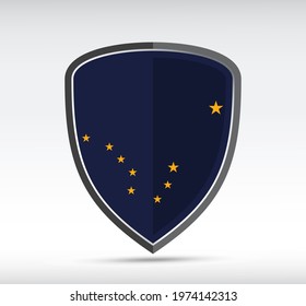 Shield icon with Alaska State Flag on gray bacground. Vector illustration.