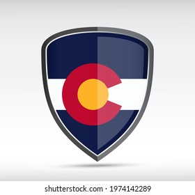 Shield icon with Coloardo State Flag on gray bacground. Vector illustration.