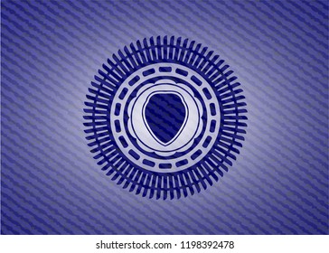 shield icon inside badge with denim texture