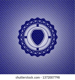 shield icon inside badge with denim background