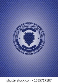 shield icon inside badge with denim texture