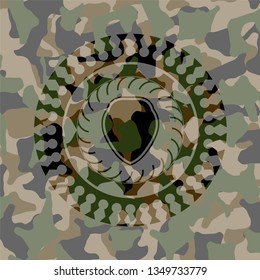 shield icon inside camouflage emblem