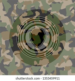 shield icon inside camouflaged emblem