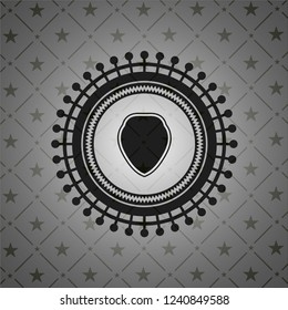 shield icon inside dark emblem