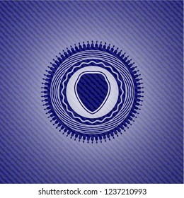 shield icon inside denim background
