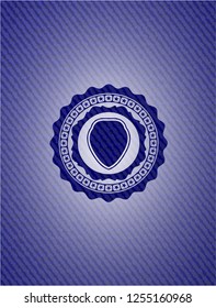 shield icon inside denim background
