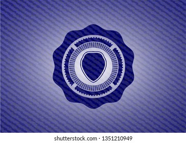 shield icon inside denim background