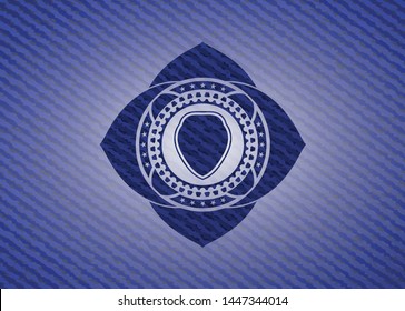 shield icon inside emblem with denim texture