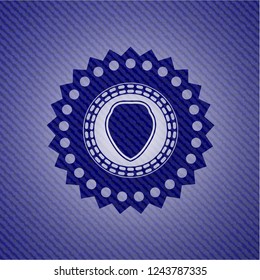 shield icon inside emblem with jean background