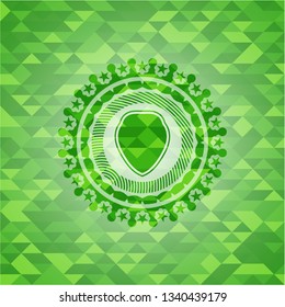 shield icon inside green emblem with mosaic ecological style background