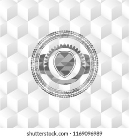 shield icon inside grey badge with geometric cube white background