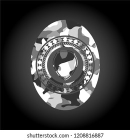 shield icon inside grey camo emblem