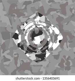 shield icon inside grey camo emblem