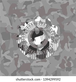 shield icon inside grey camo texture