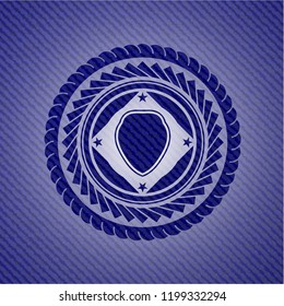 shield icon inside jean or denim emblem or badge background