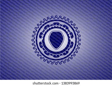 shield icon inside jean or denim emblem or badge background
