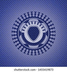 shield icon inside jean or denim emblem or badge background