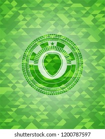 shield icon inside realistic green mosaic emblem