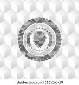 shield icon inside realistic grey emblem with geometric cube white background