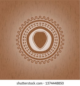 shield icon inside realistic wood emblem
