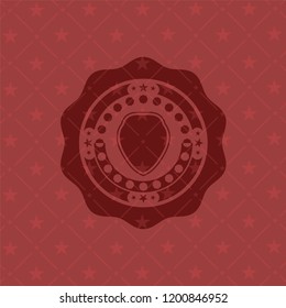 shield icon inside red emblem