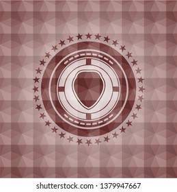 shield icon inside red seamless emblem or badge with geometric pattern background.