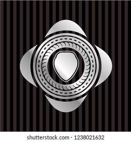 shield icon inside silvery badge