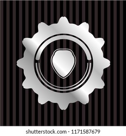 shield icon inside silvery emblem or badge