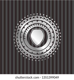 shield icon inside silvery emblem or badge