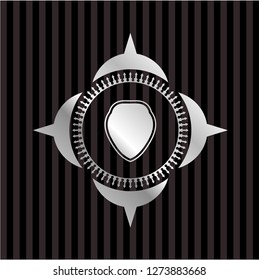 shield icon inside silvery shiny badge